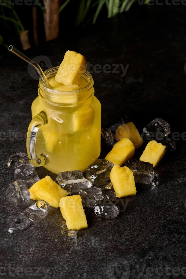 pineapple drink or iced lemonade in a mason jar. photo