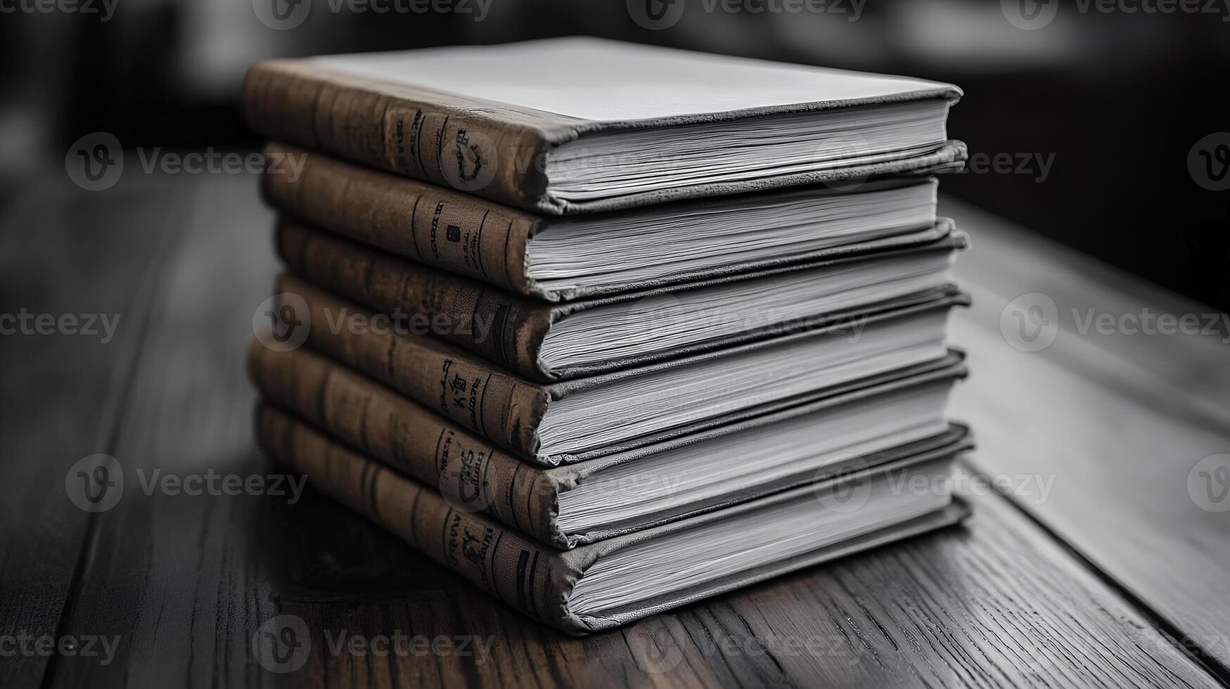 Stack of books on wooden table photo