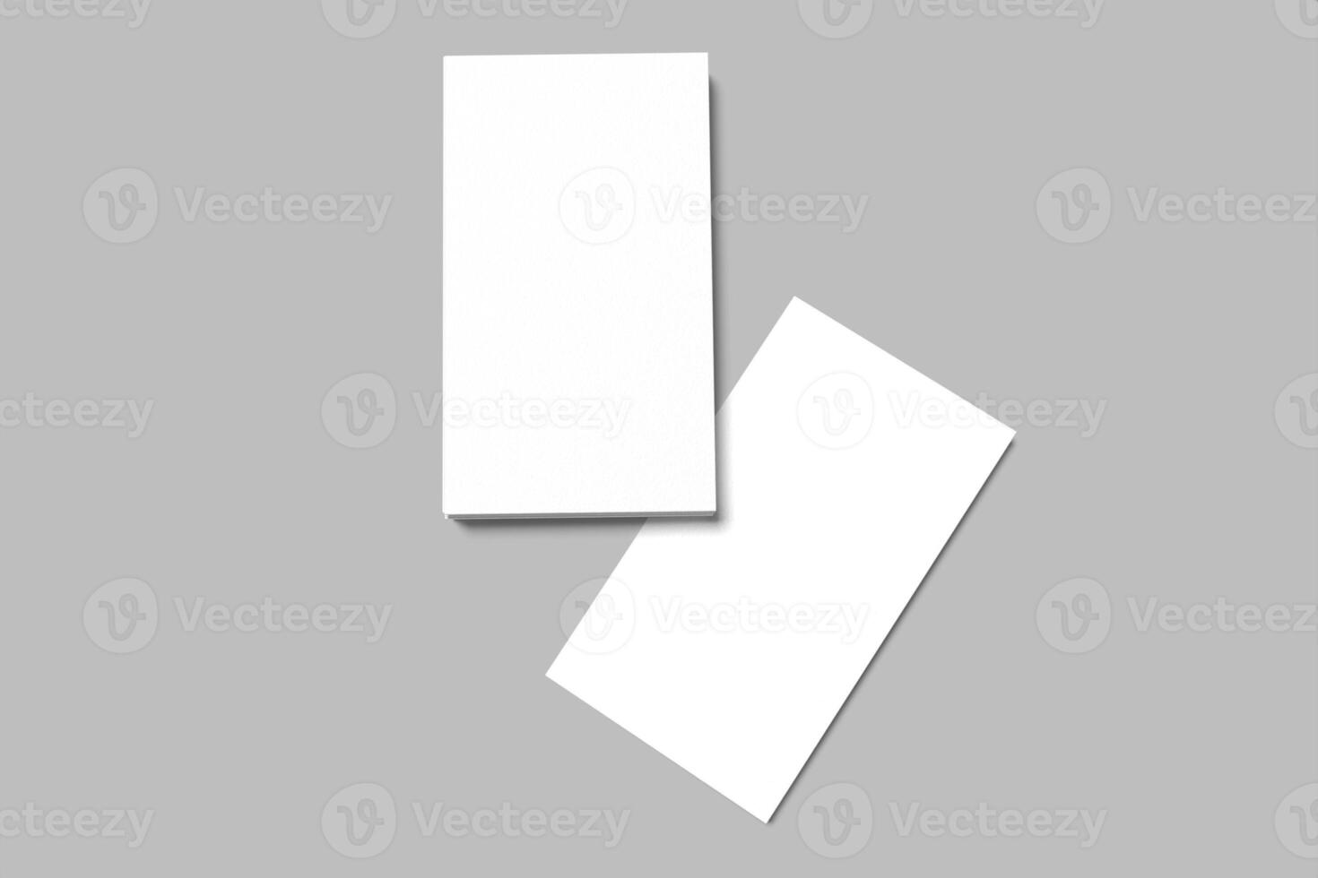 Two blank white cards on a gray background photo