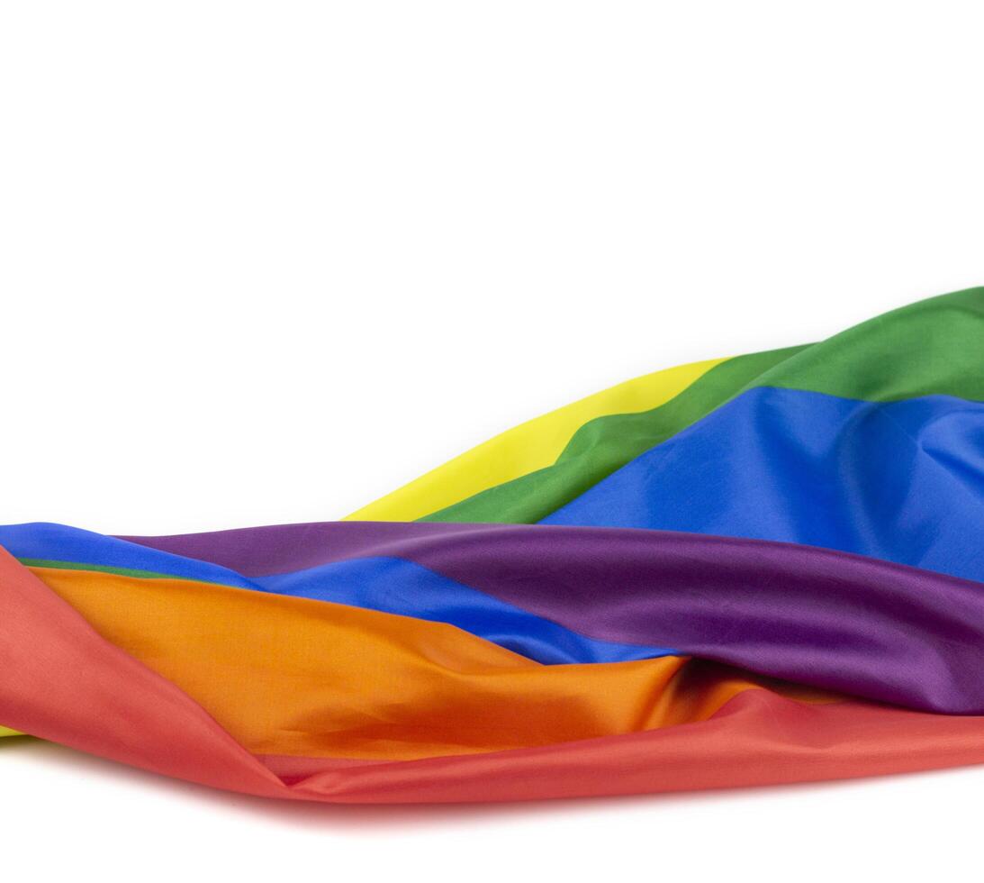 1. Colorful rainbow flag on white background. Concept of cheering LGBT communities all over the world photo