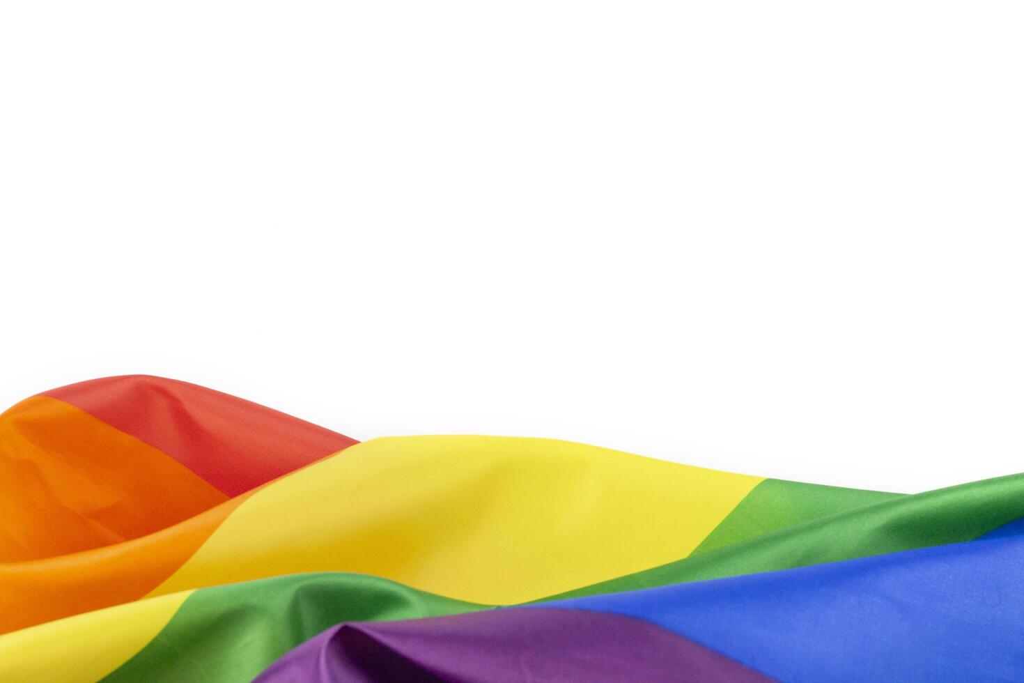 4. Colorful rainbow flag on white background. Concept of cheering LGBT communities all over the world photo