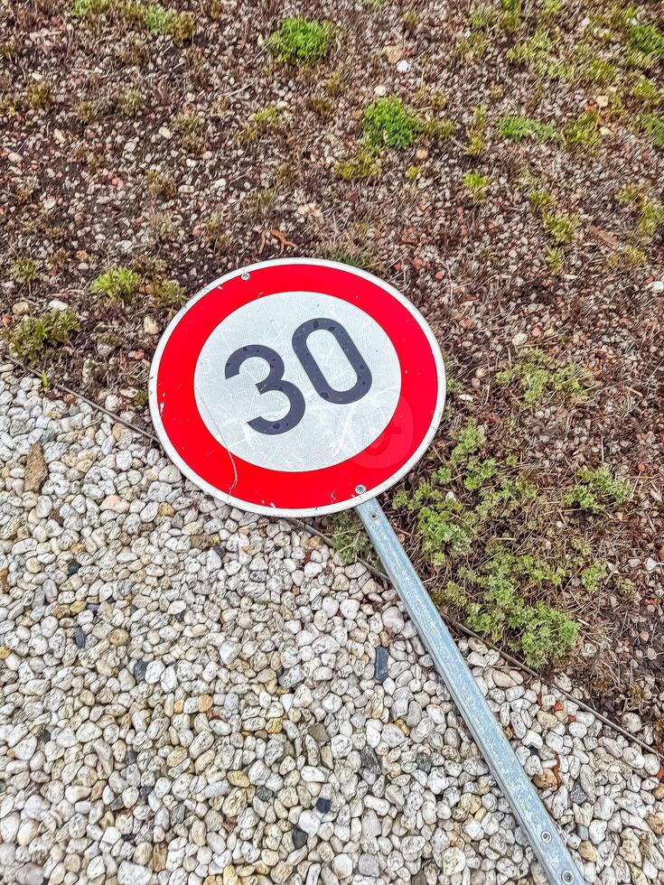 30 kmh Speed Limit Sign on Ground, Urban Environment, Road Safety, Transportation, Regulations. High quality photo