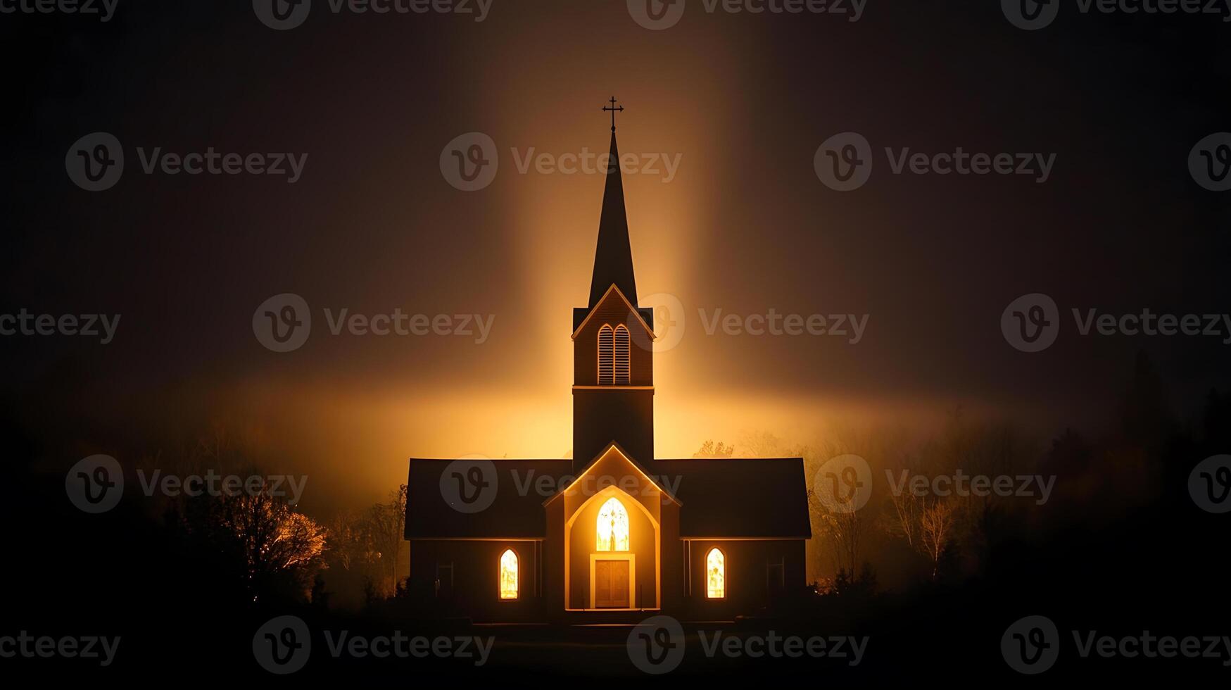 Church at night with light shining from the top photo