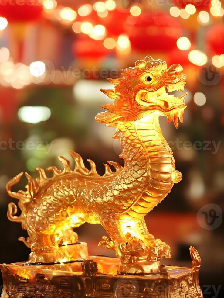 Golden dragon statue on a table in front of red lanterns photo
