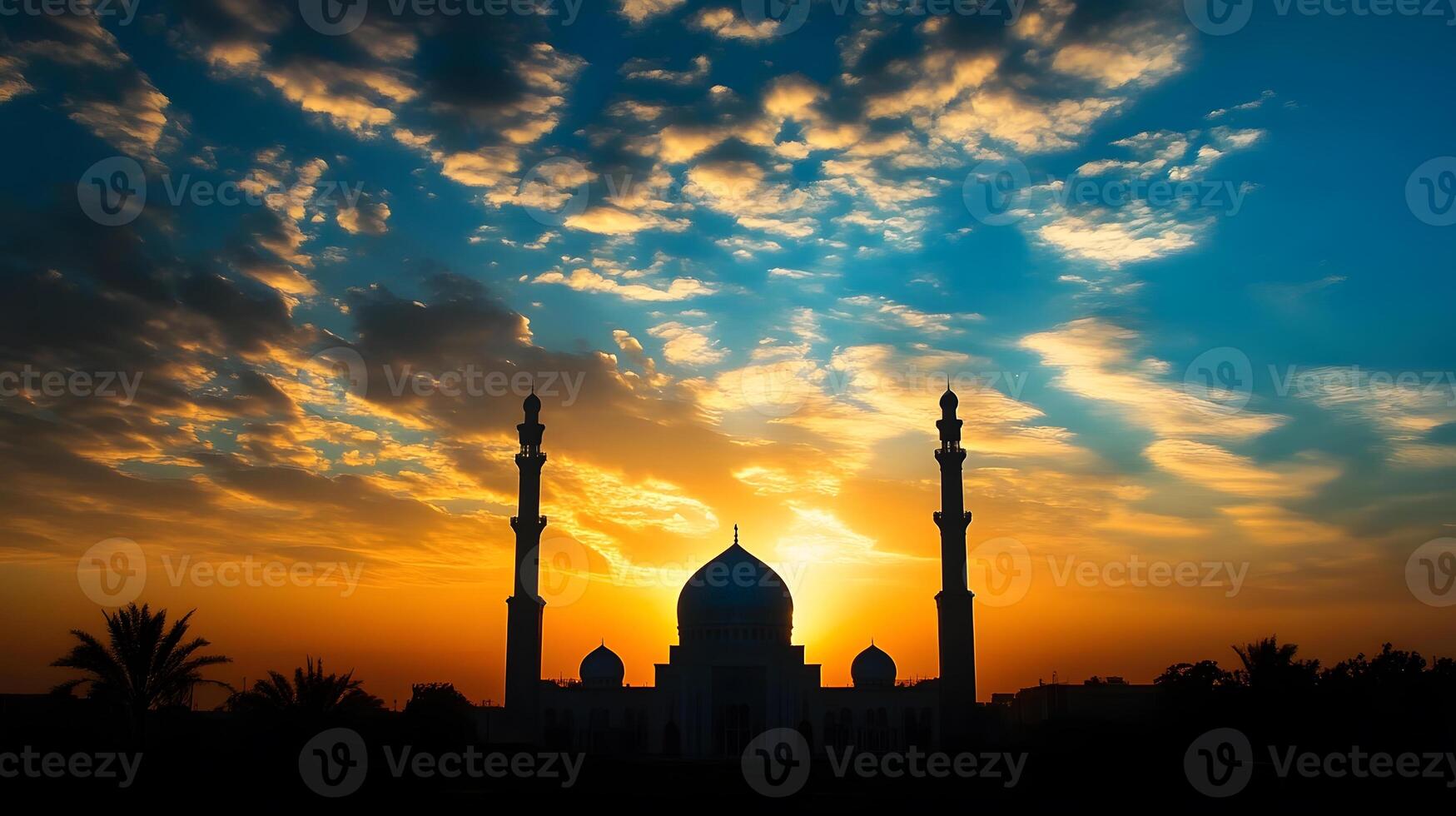 The sun sets behind a mosque in the middle of the desert photo