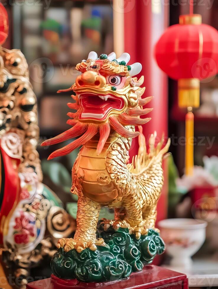 A gold dragon statue is on display in a chinese store photo