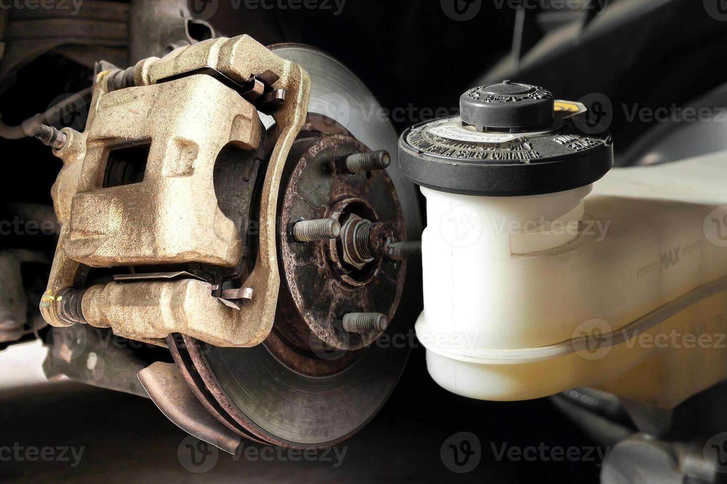 Close up of disc brake and brake fluid reservoir , Car brake system components , Car repair concept photo