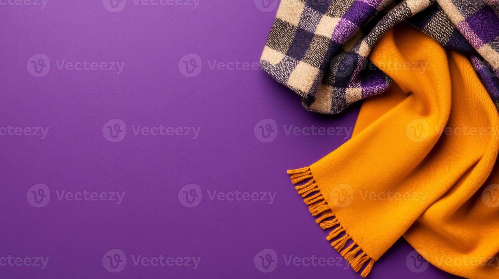 Textured Fabrics Folded Gracefully on a Solid Color photo