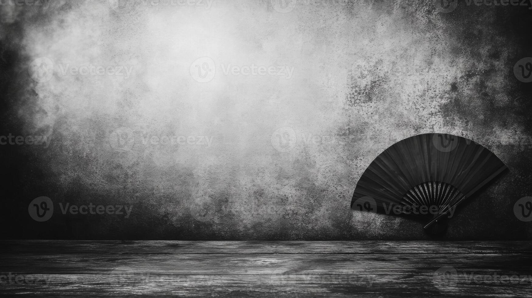 A lonely fan rests against a textured wall under dramatic light photo