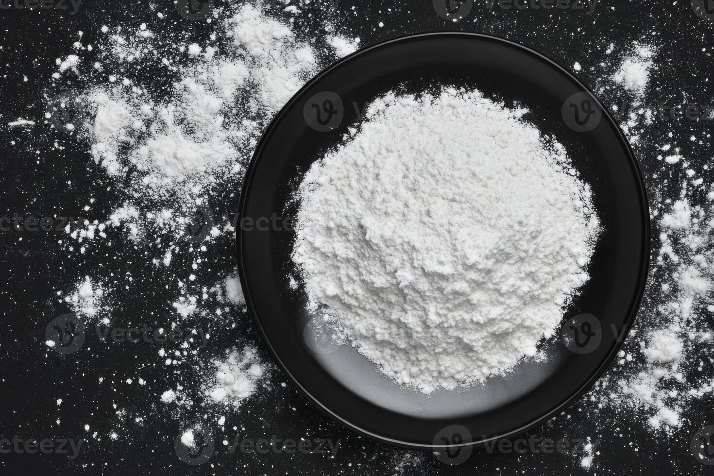 White Powder Pile in Black Round Bowl on Dark Surface photo