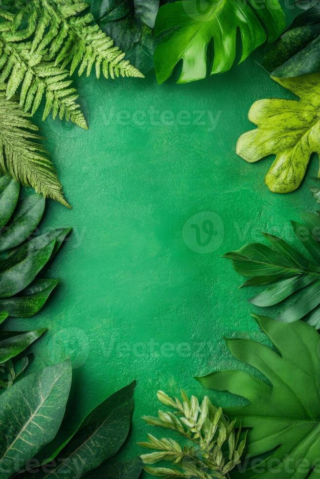 Assorted Green Leaves Framing a Vibrant Emerald Stone Surface photo