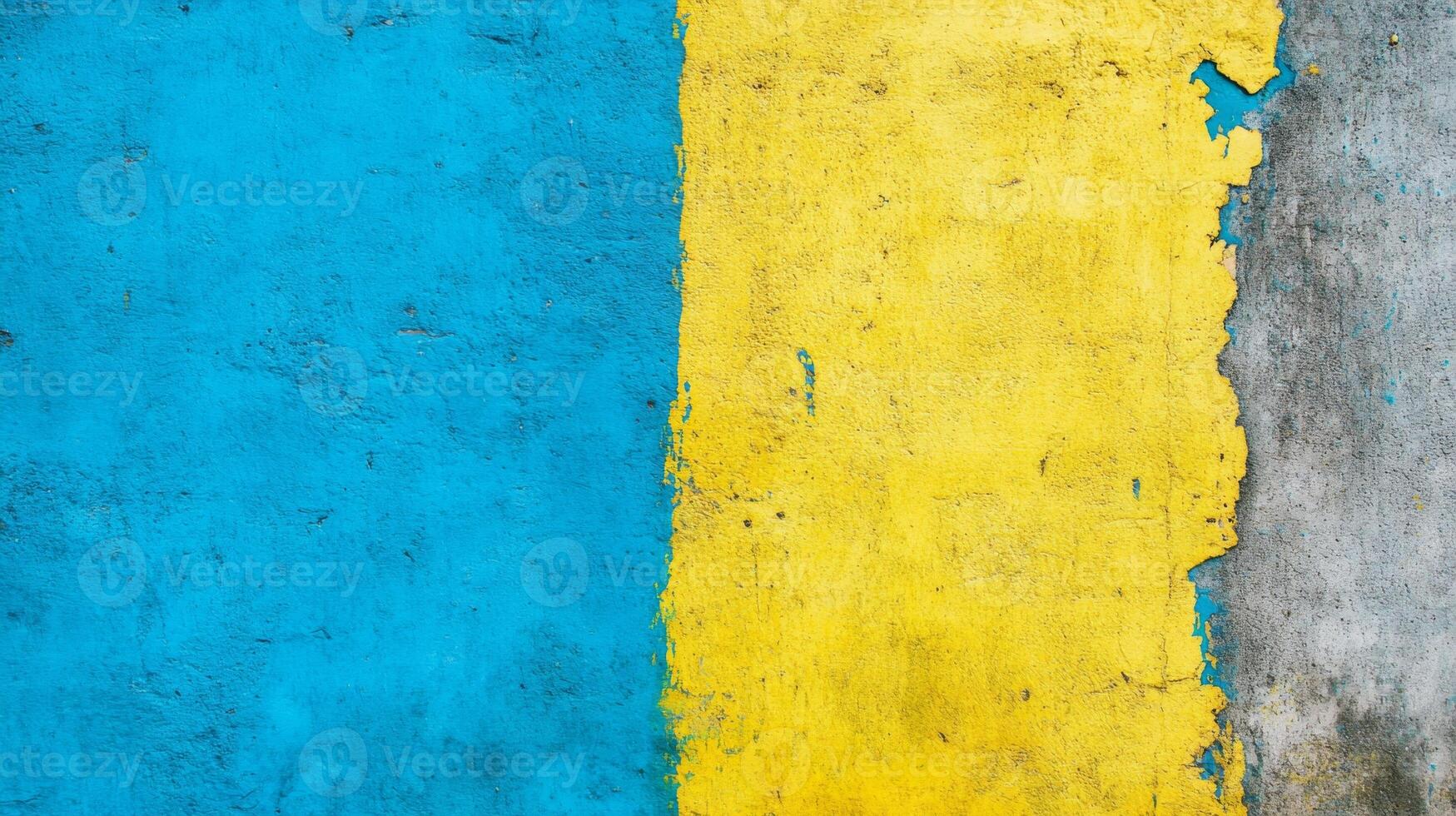 Weathered Wall with Peeling Blue and Yellow Paint Over a Gray Base photo