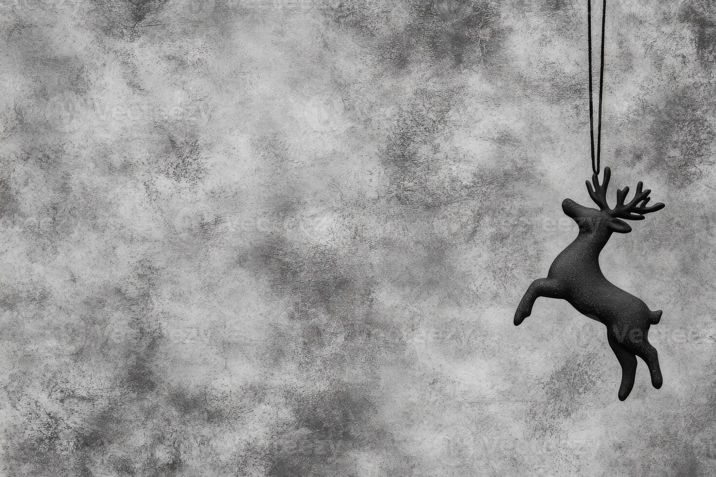 Leaping Deer Ornament Suspended on a Cord with a Rough Abstract Backdrop photo