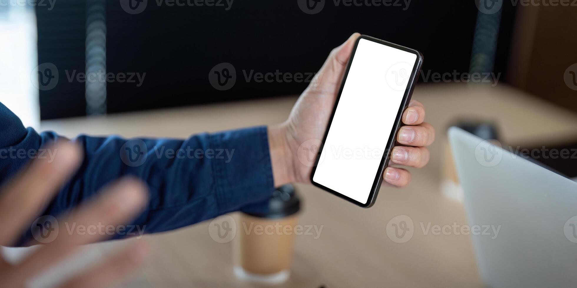 Technology and Connectivity. A man shows a smartphone during a business discussion. photo