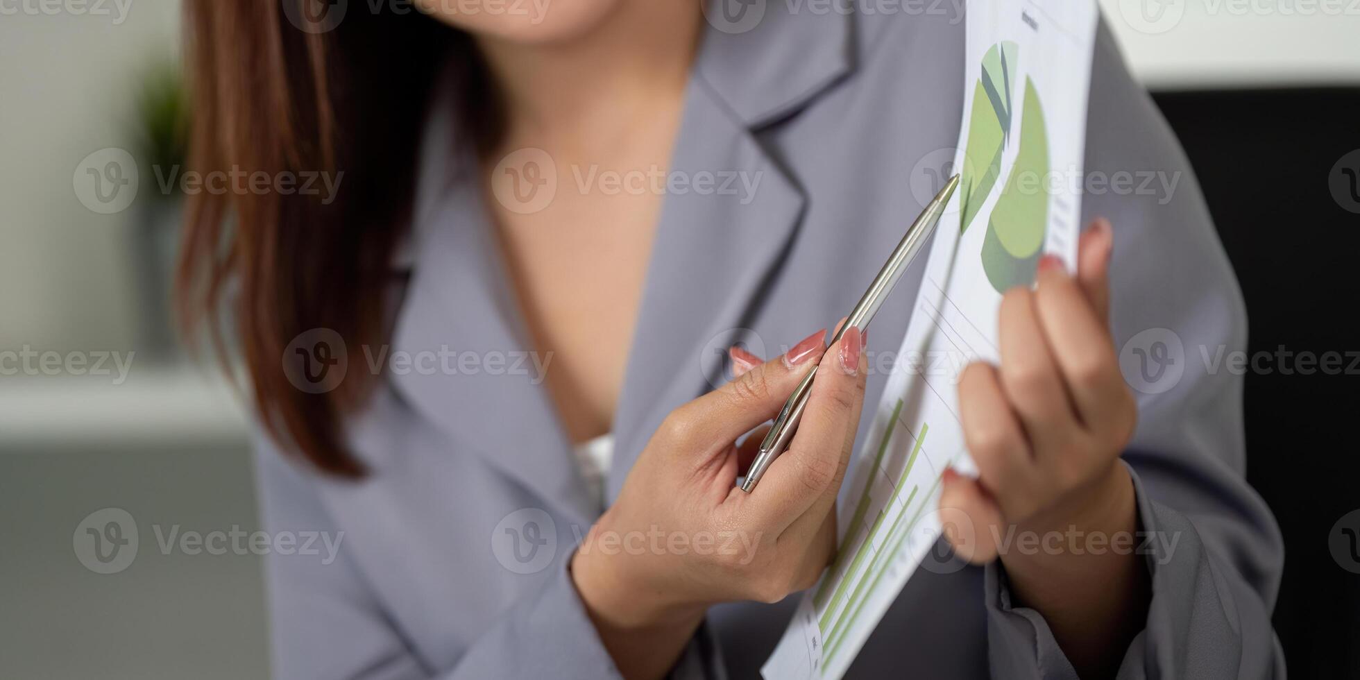 Data Presentation and Engagement. A colleague presents data insights to spark discussion during a team meeting. photo