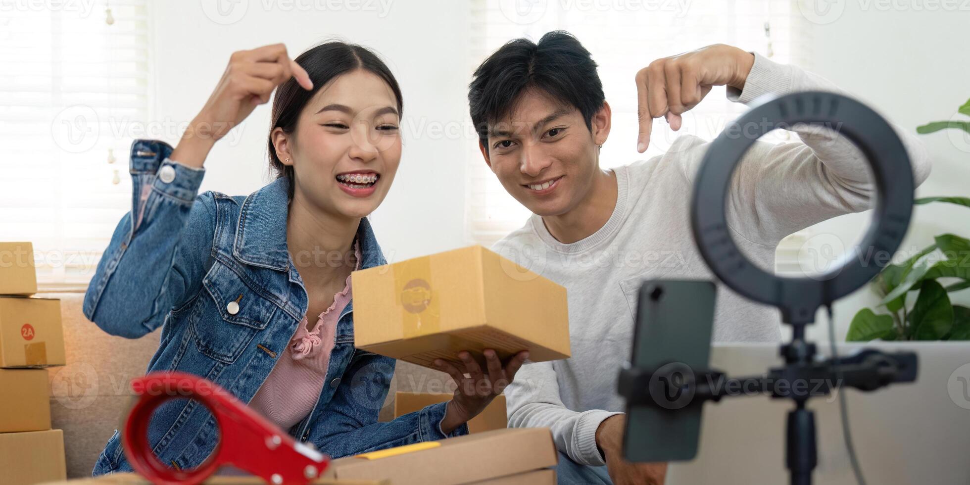 Entrepreneurship and Creativity. Joyful couple demonstrating their new products in an engaging . photo