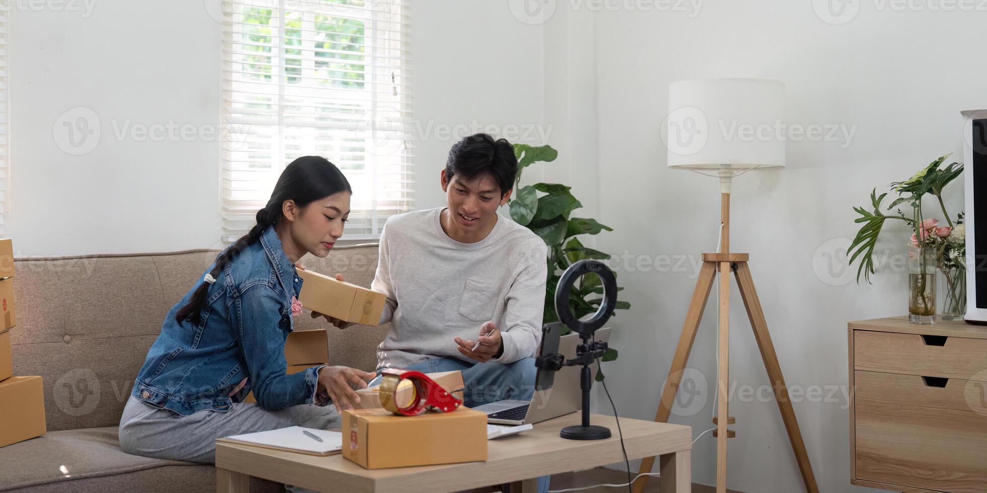 Entrepreneurial Spirit and Engagement. A couple discussing their upcoming online event while coordinating their packages. photo