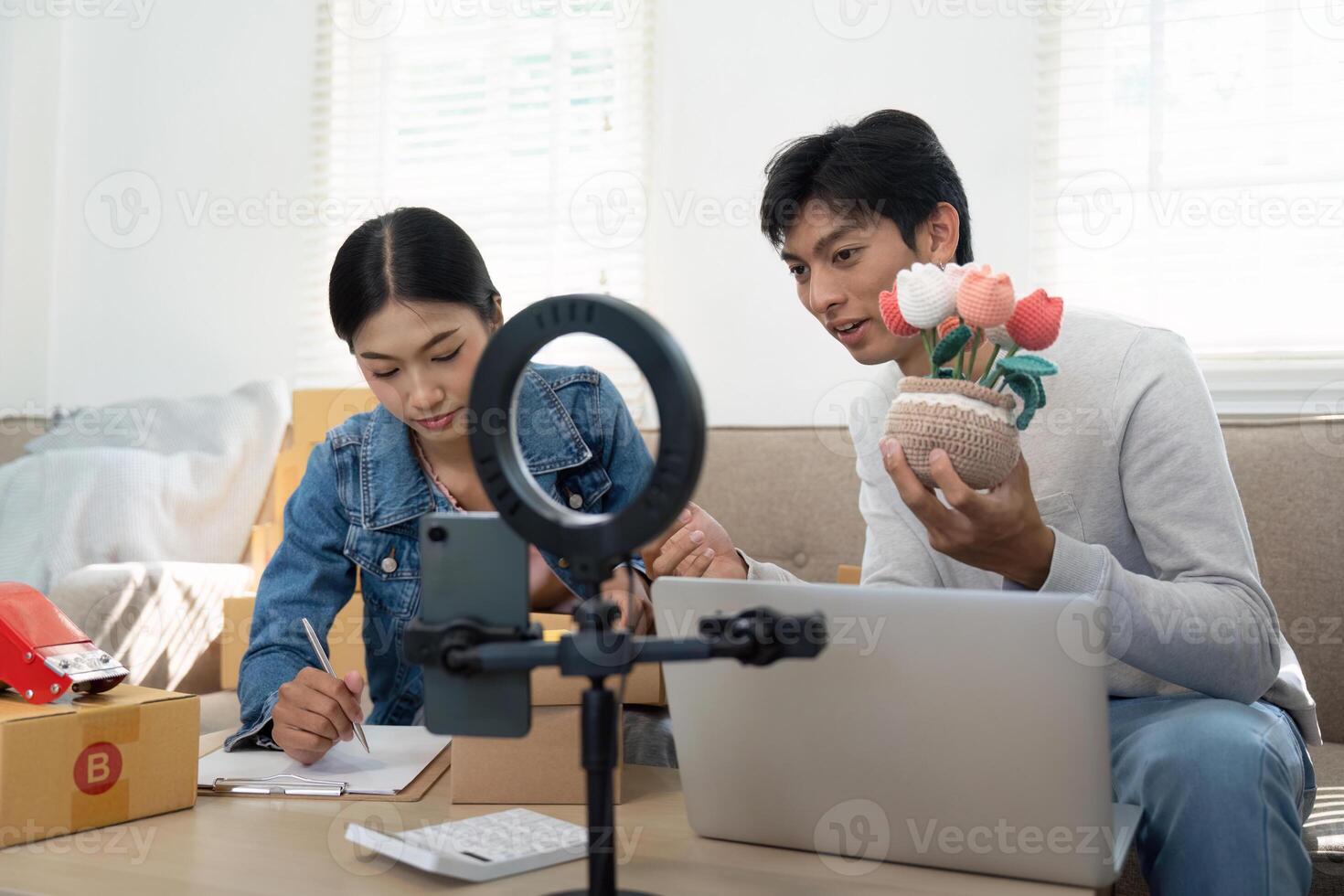 Entrepreneurship and Collaboration. A couple planning their business strategy while showcasing handmade products. photo