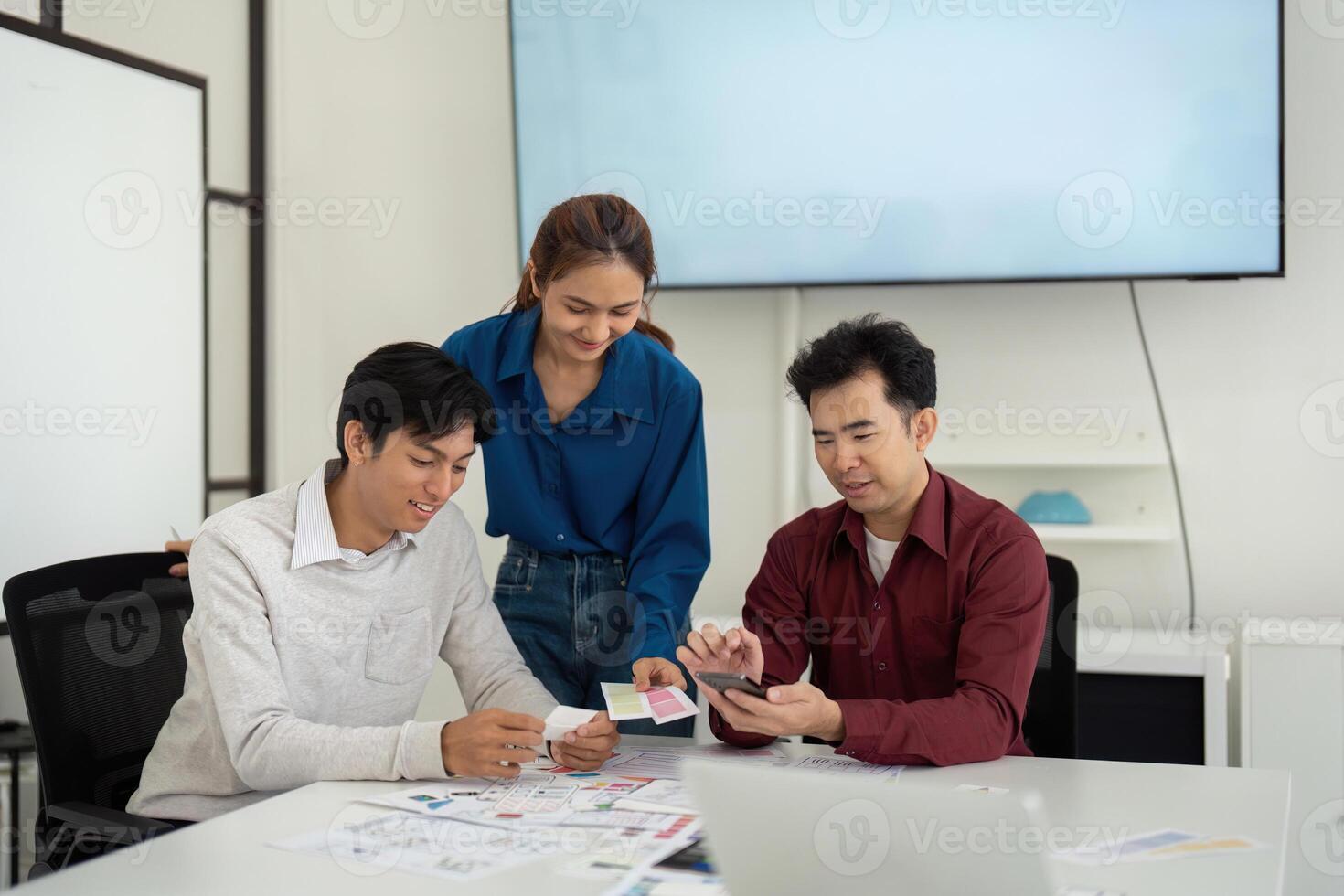Collaborative UX UI Review Session. Designers evaluate concepts together, discussing the next steps for their projects. photo
