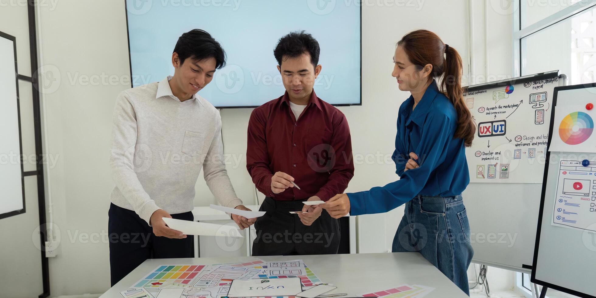 Design Workshop and Interactive Learning. Team members exchanging wireframe ideas in a productive environment. photo