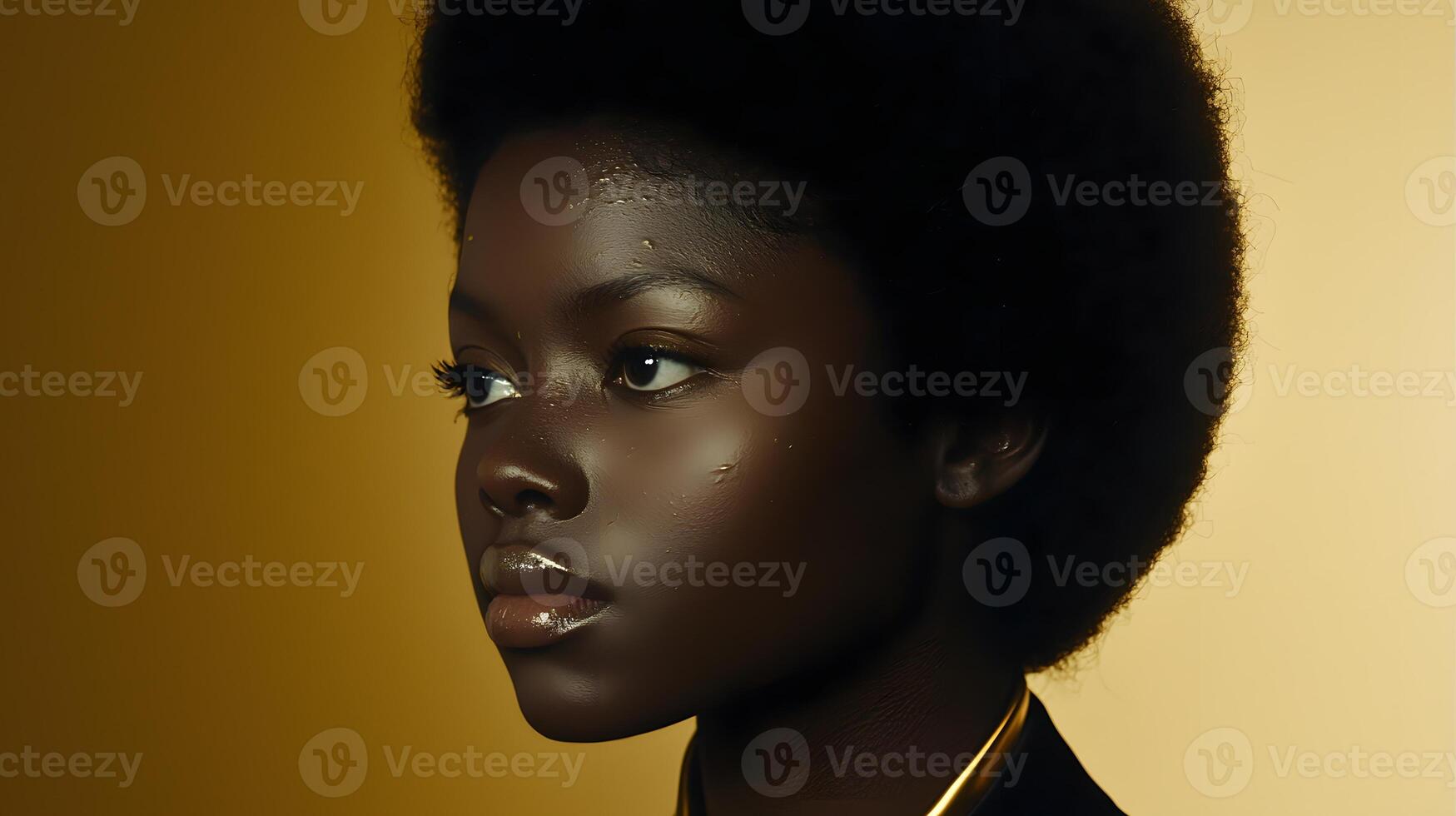 A woman with an afro and gold makeup photo