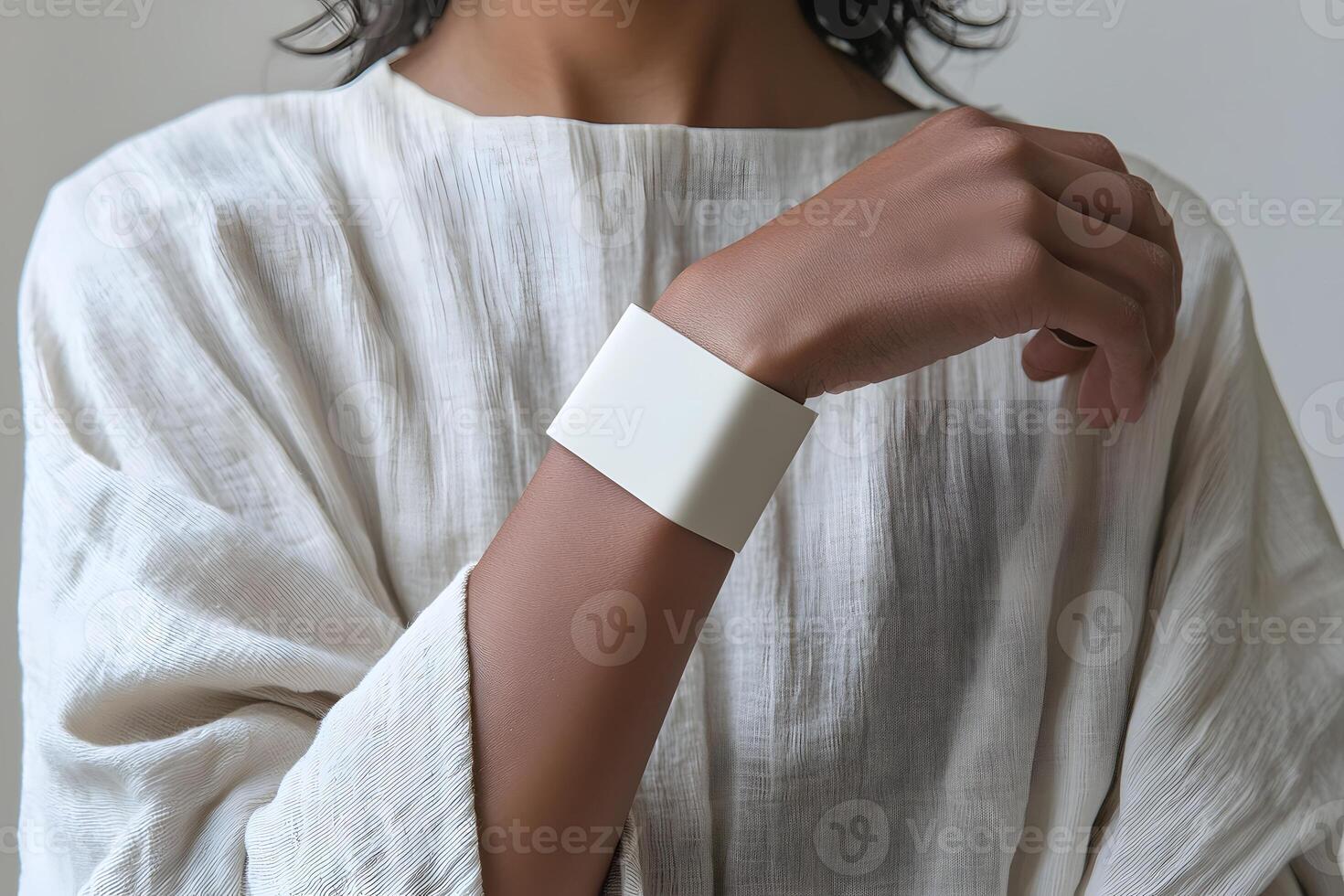 Woman s Arm with Blank White Wristband Mockup Cream Linen Shirt photo