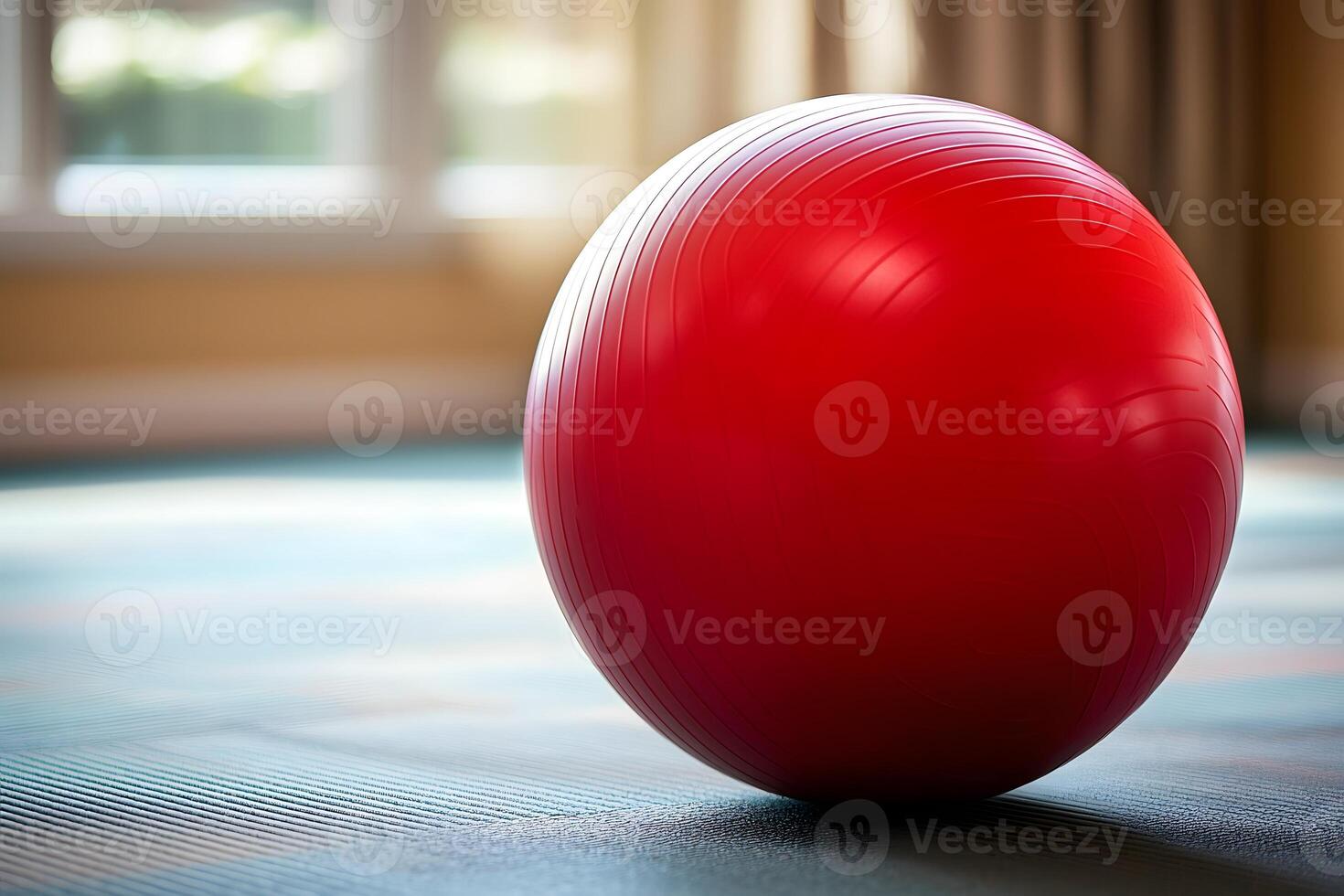 Red Exercise Fitness Ball on Gym Floor Wellness Sport Physical Therapy Equipment photo