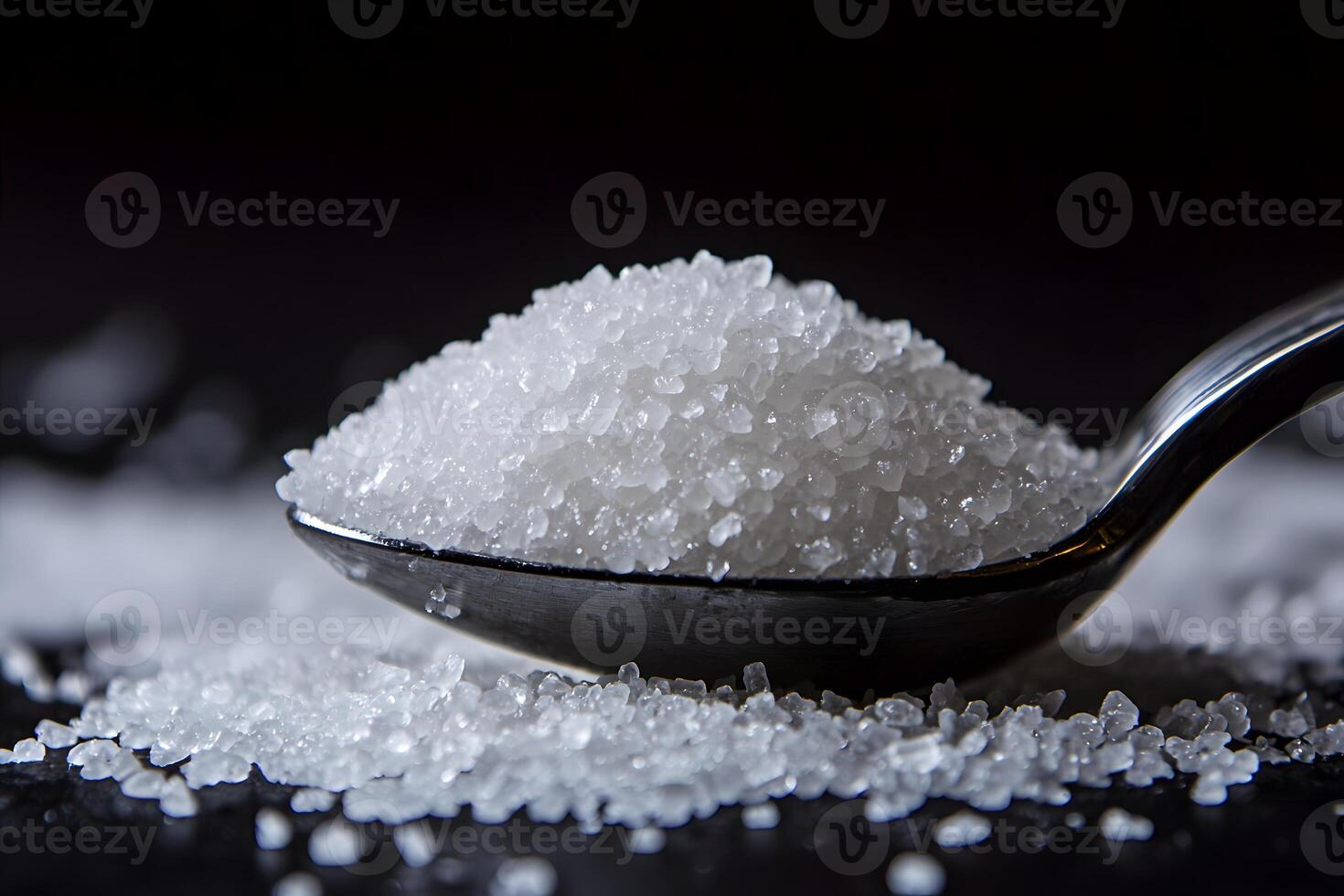 Close up of Granulated Sugar Crystals on a Spoon Macro Photography of White Sugar photo