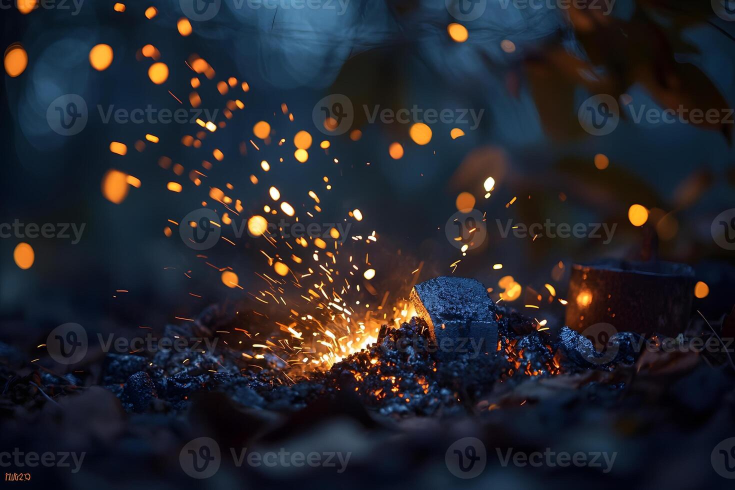 Glowing Embers and Sparks Nighttime Campfire Detail with Bokeh photo
