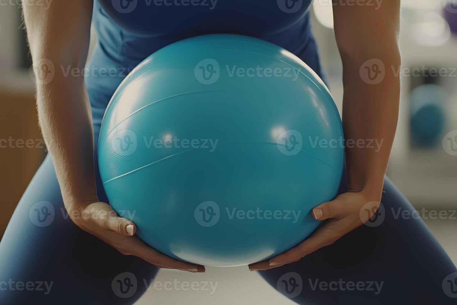 Woman holding teal exercise ball fitness workout healthy lifestyle active wellbeing photo