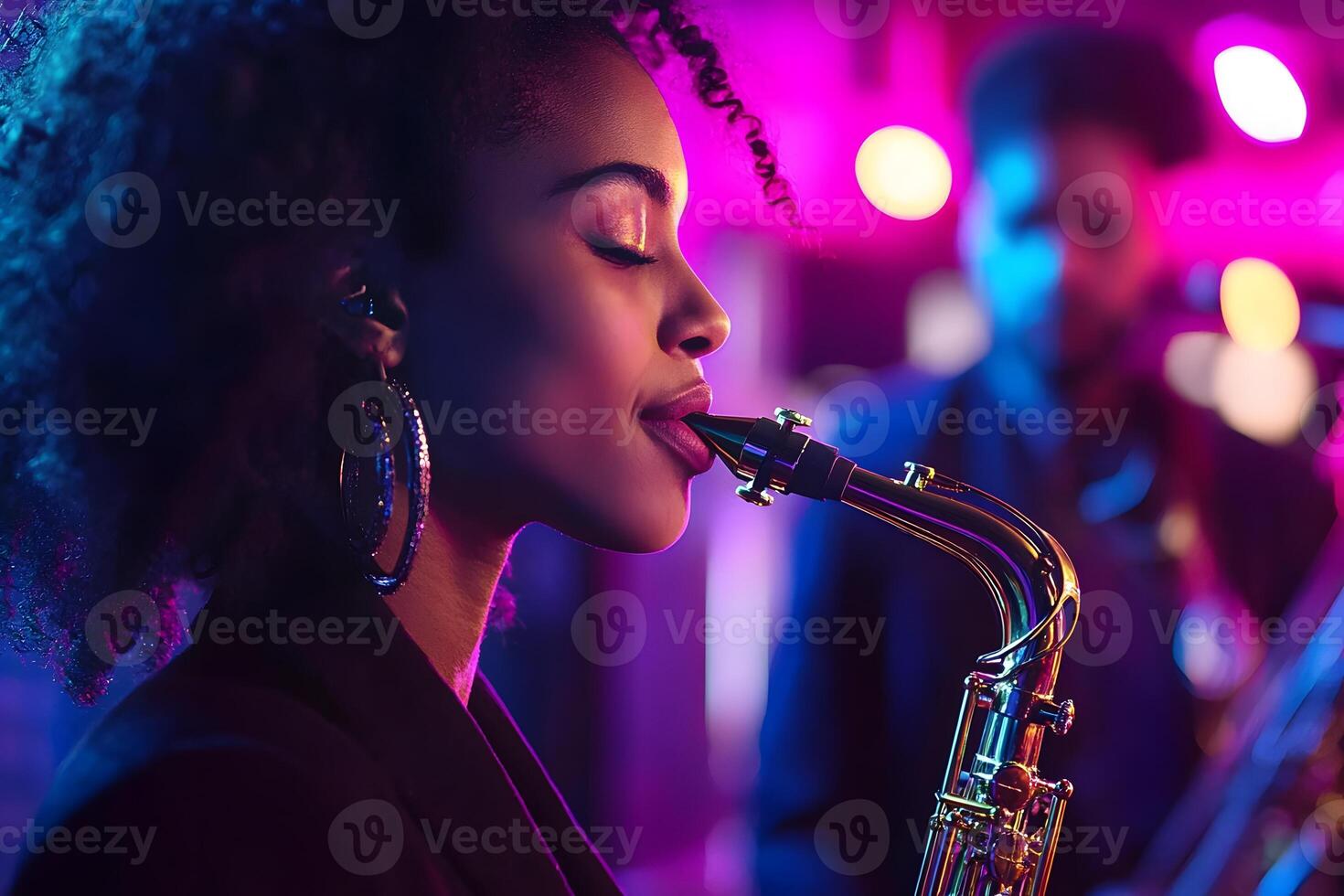 A woman playing the saxophone in front of a band photo