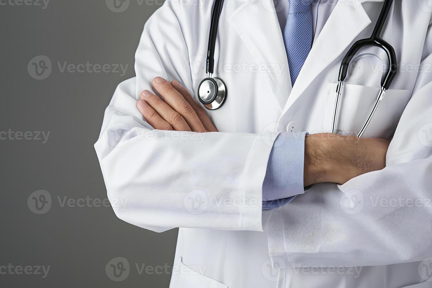 A male doctor in a white coat and tie photo