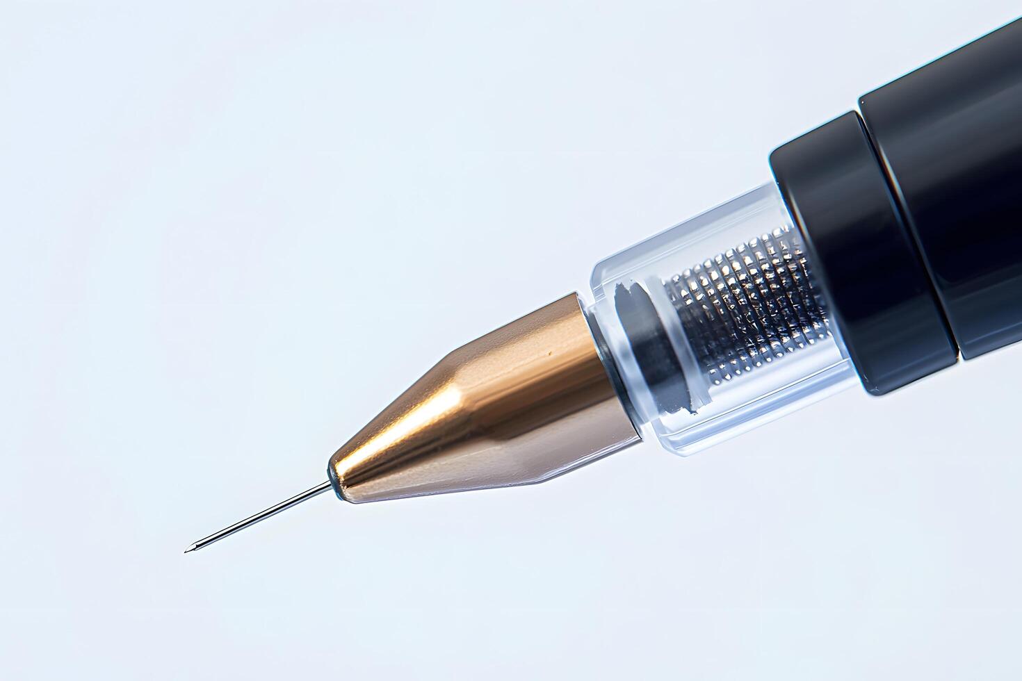 Close up of a Precision Drafting Pen with Gold Tip and Transparent Mechanism photo