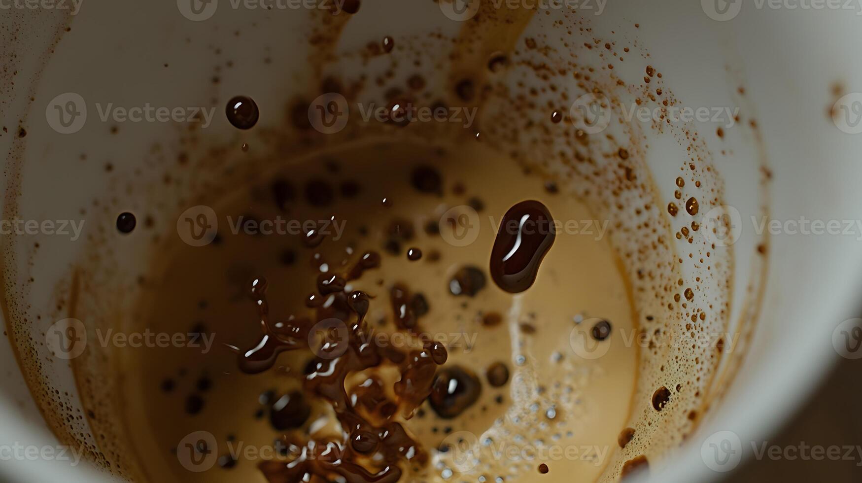 Coffee Splash Close up of Espresso Droplets Falling into Creamy Foam in a White Cup photo