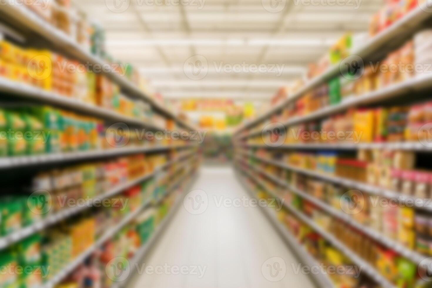 Grocery store aisle filled with various food products during daylight, blurred background. photo