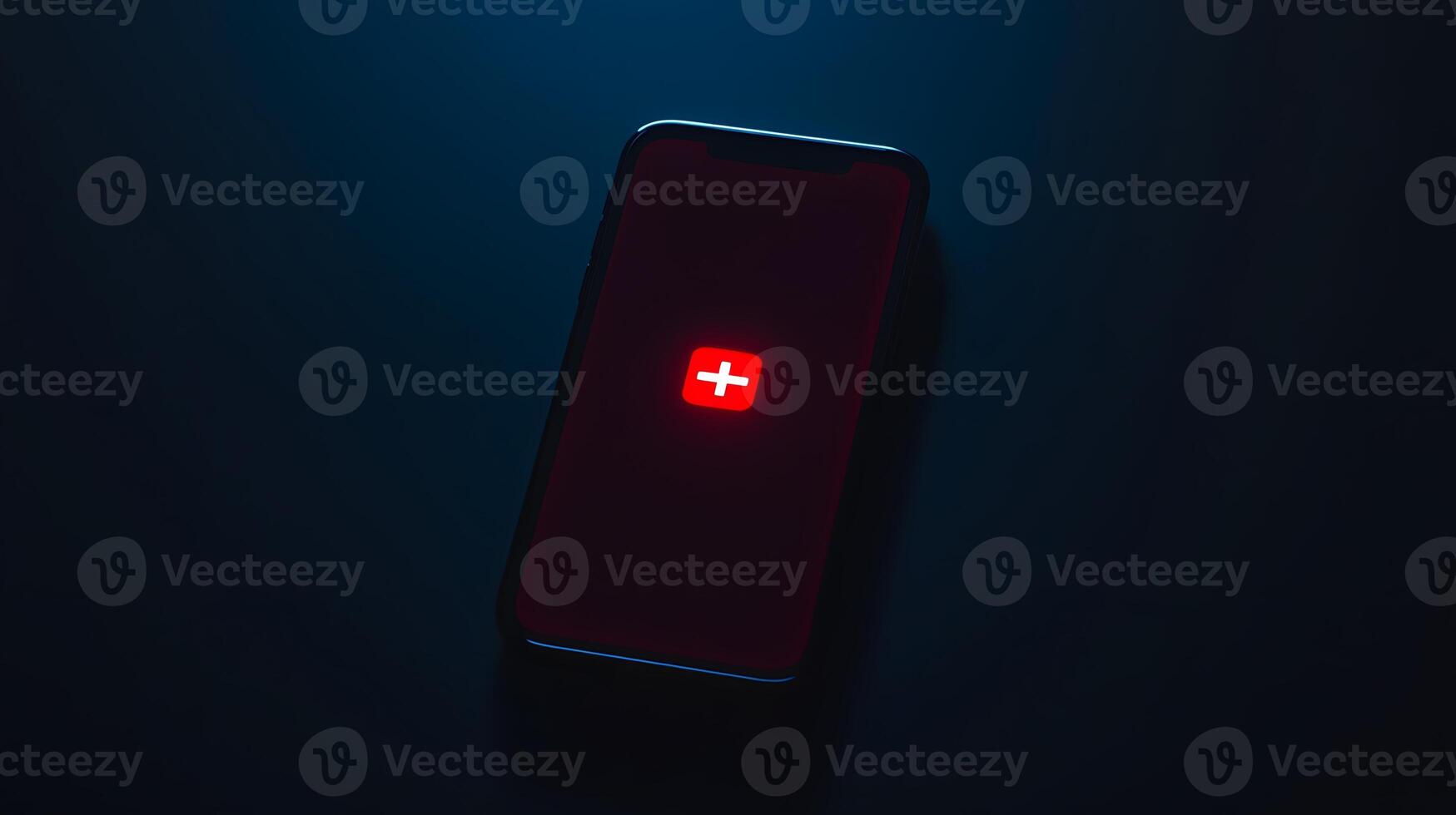 Smartphone Displaying Red Plus Icon in Dark Low Light Setting photo