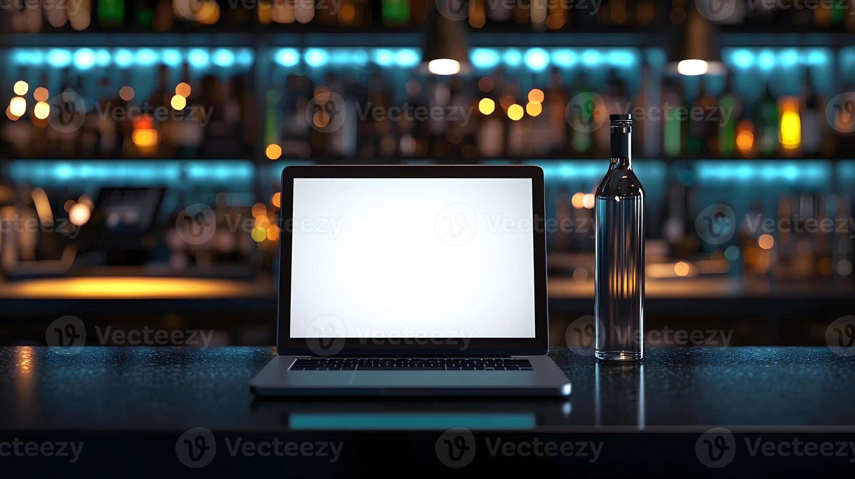 Laptop and Bottle on Bar Counter Nighttime Bar Setting Blank Screen photo