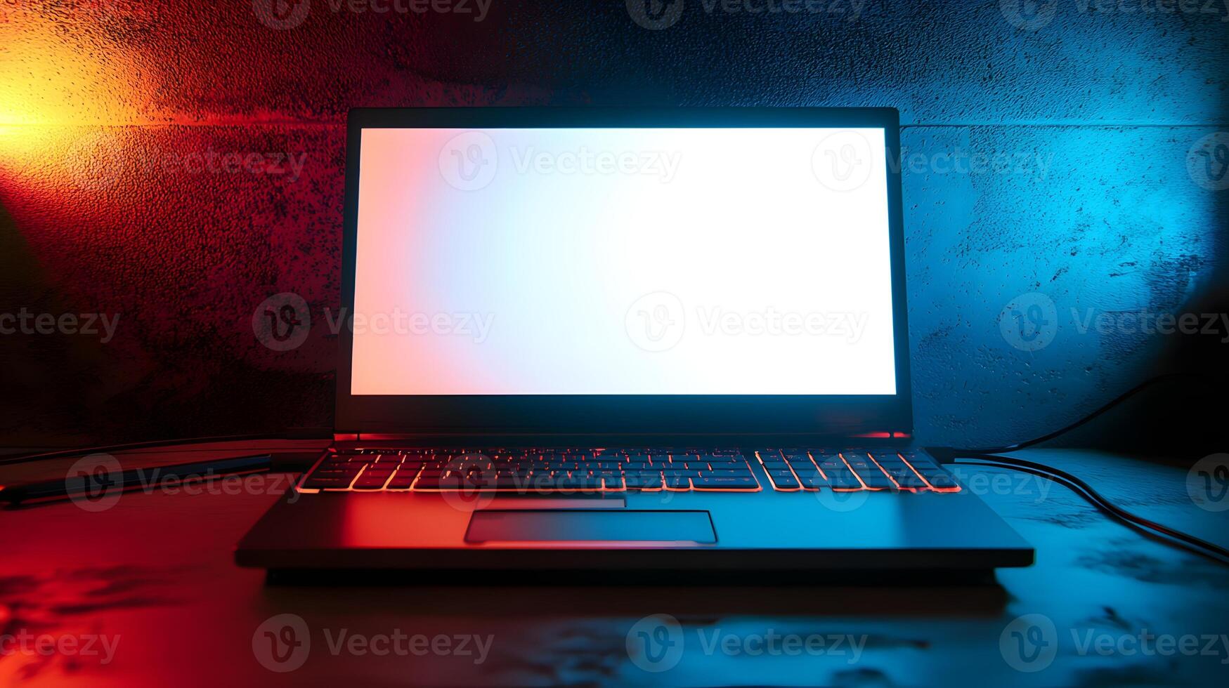 Modern Laptop Computer with Blank Screen Illuminated by Red and Blue Neon Lights photo