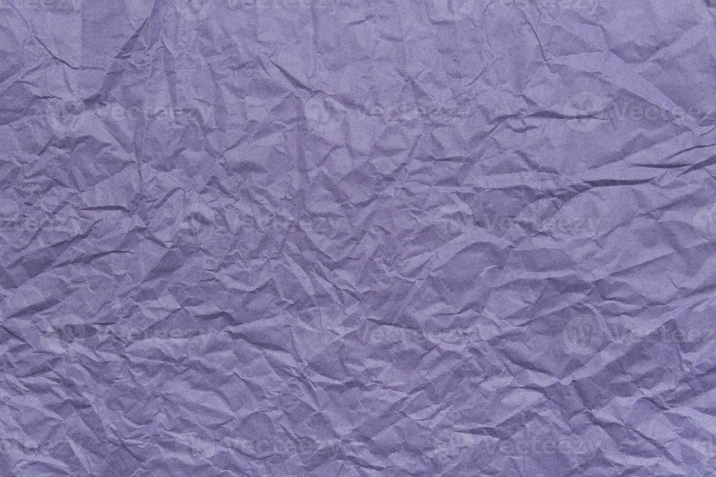 Crinkled violet paper texture photo