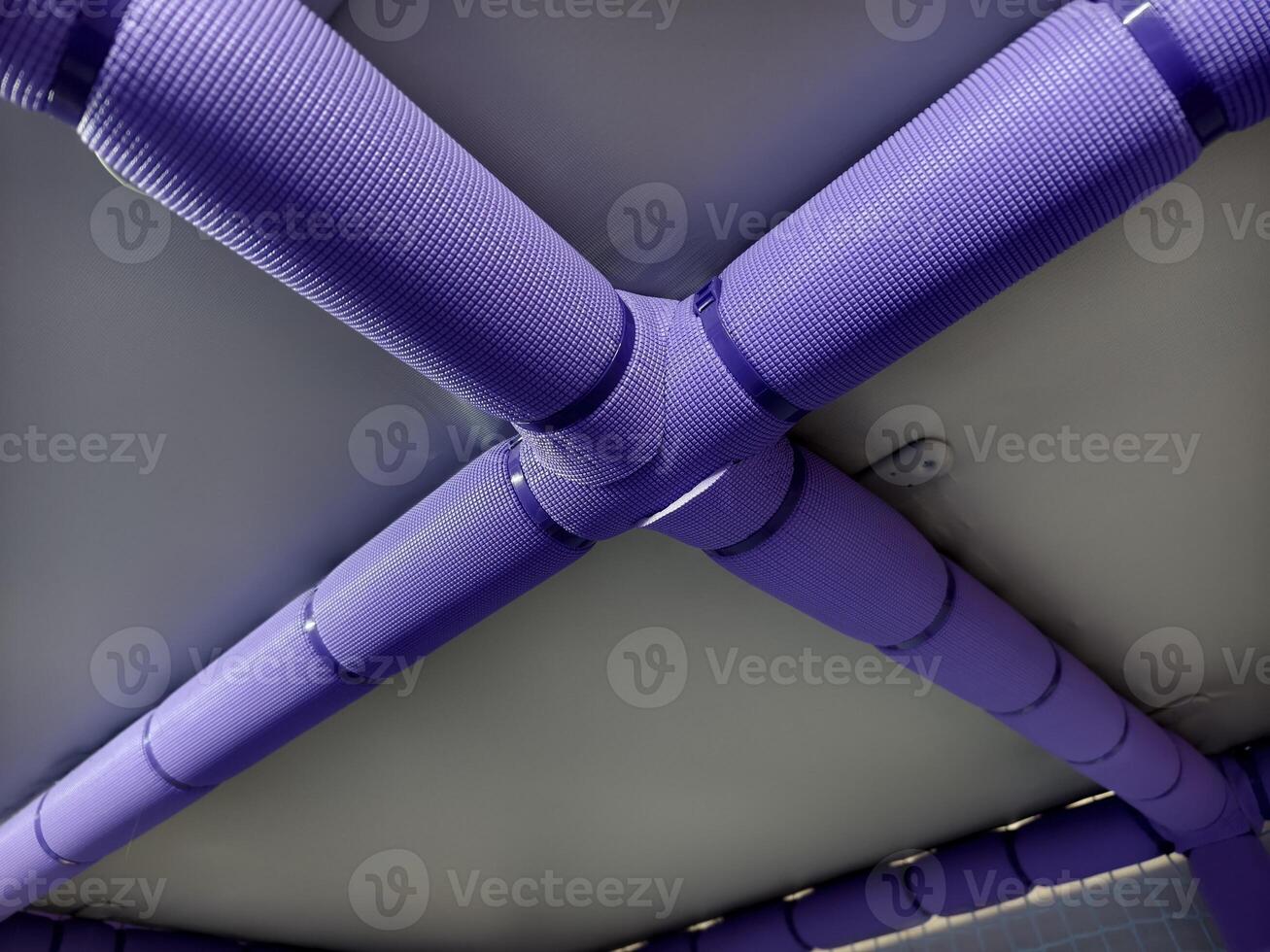 Purple Textured Pipes in Industrial Ceiling Structure with Unique Design photo