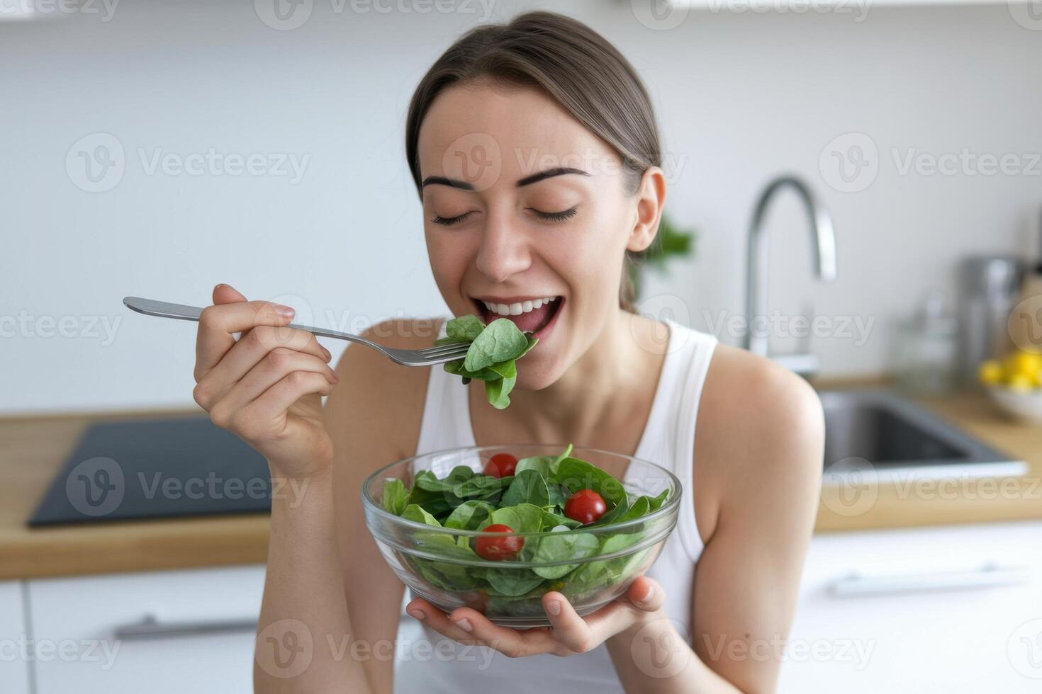 Woman Enjoying Salad Healthy eating, fresh ingredients, and a happy, wholesome lifestyle choice photo