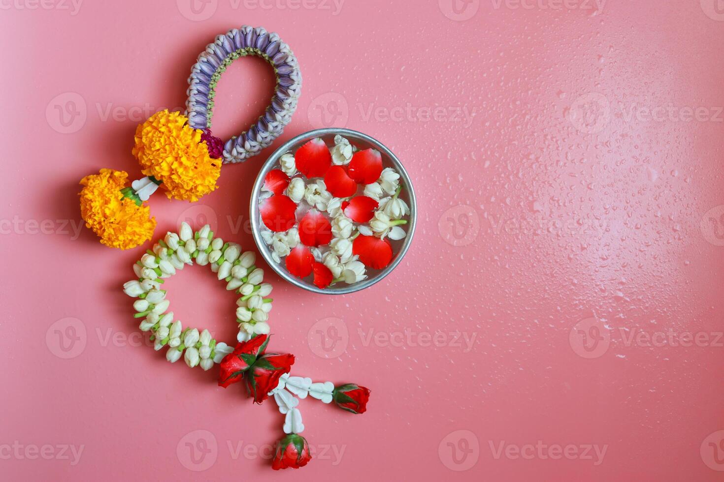 Jasmine garlands top view on pink color background with copy space. photo
