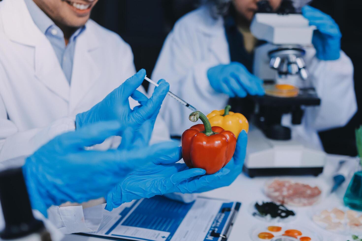 Two people in lab coats are holding a vegetable photo