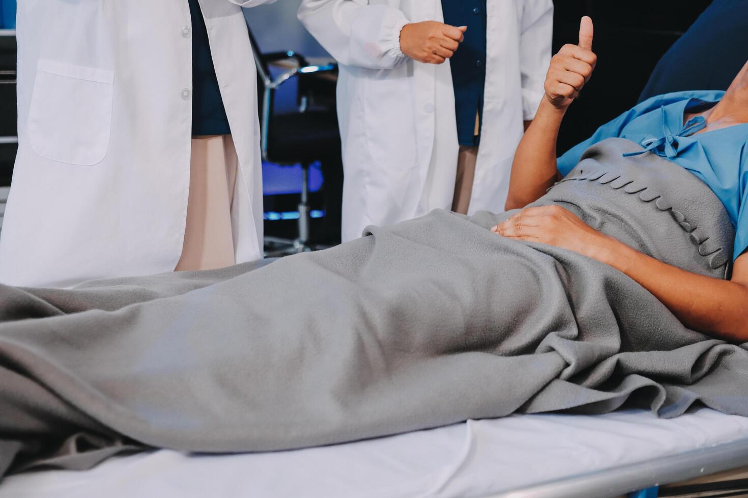 A woman laying on a hospital bed photo