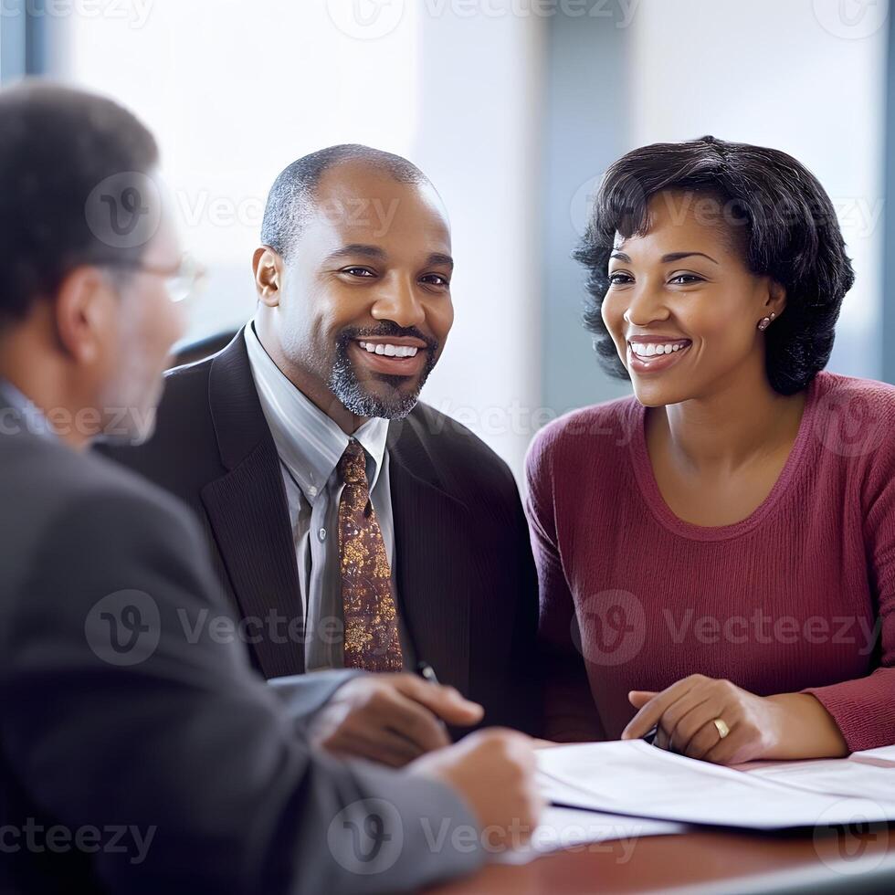 Insurance agent explaining policy benefits to a smiling couple photo