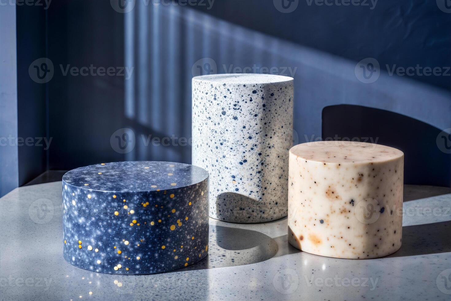 Stone product display podiums. Terrazzo, marble, granite textured cylinders in natural light. Home decoration studio shot. photo