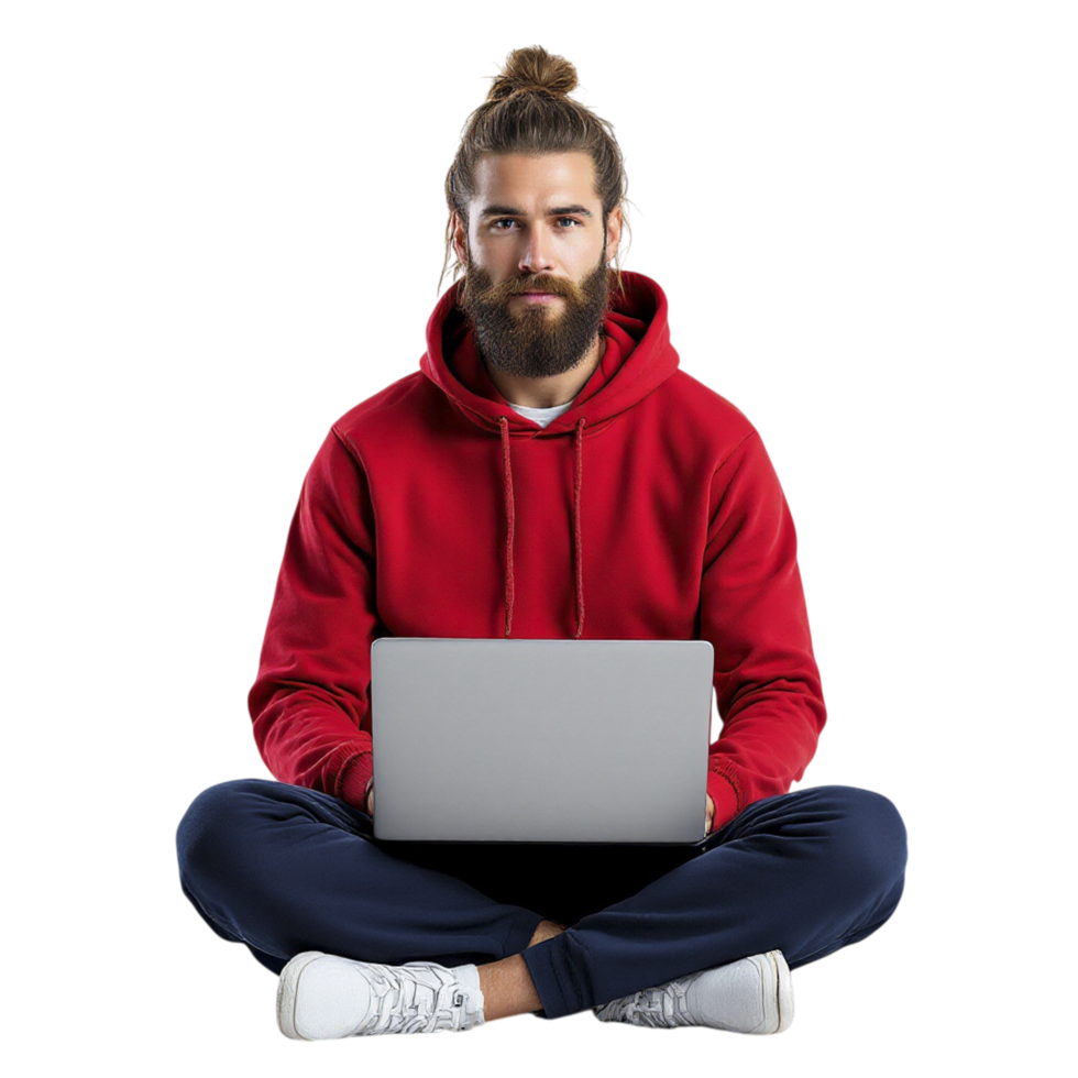 A man with a beard and a red hoodie sitting on the floor with a laptop png