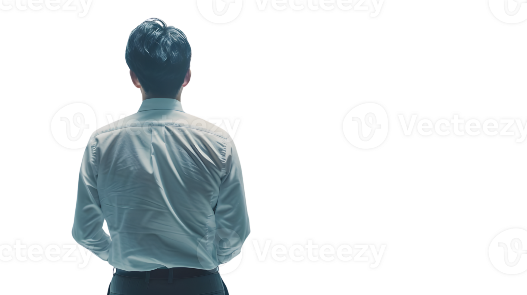 A man in a light blue shirt viewed from behind standing confidently with hands in pockets png