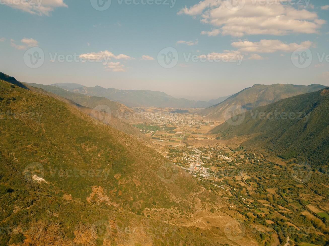 aerial view of village among mountains in mexico photo
