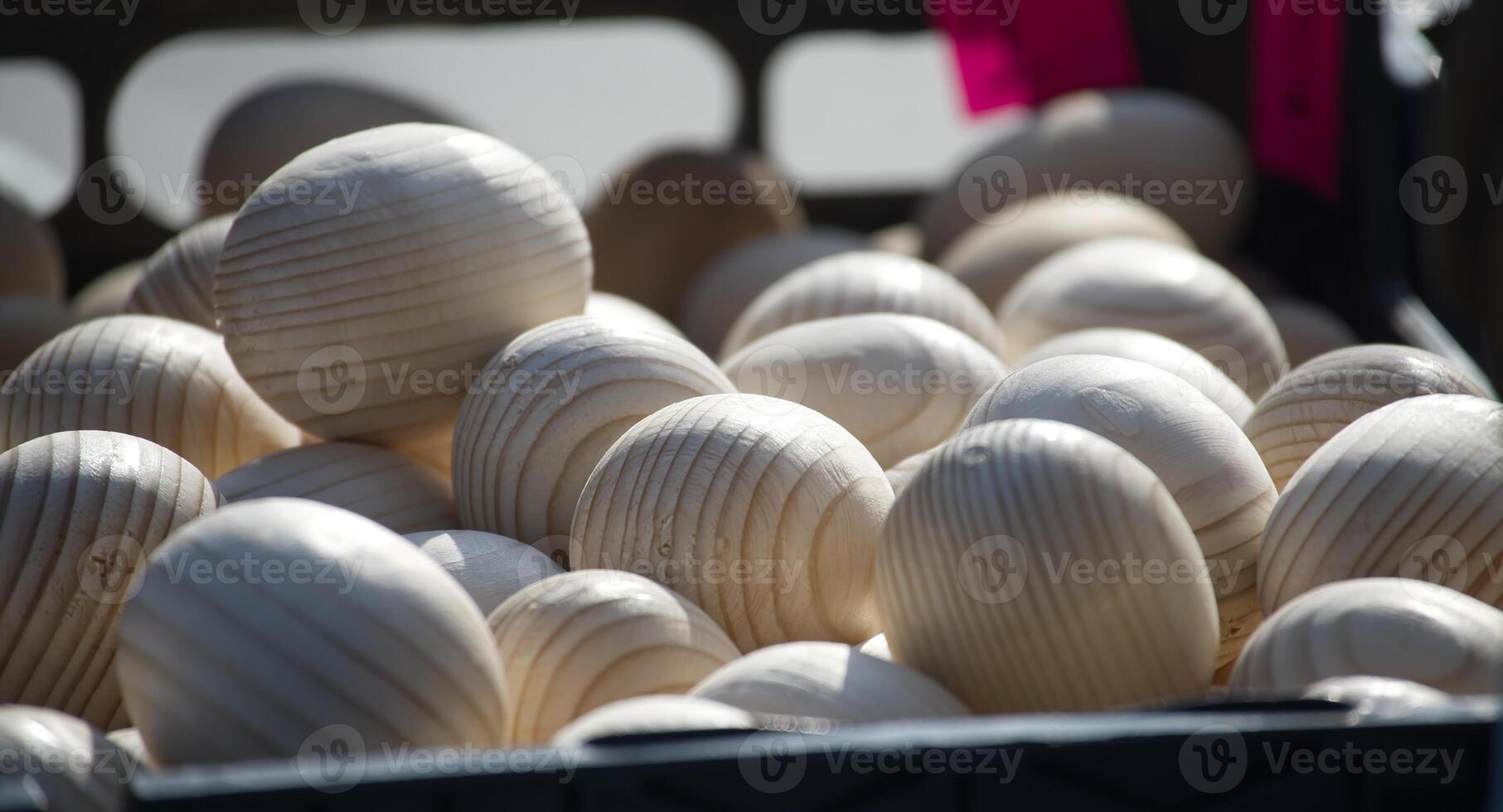 Wooden eggs fill a crate, ideal for Easter decor and crafting projects. Rustic charm photo